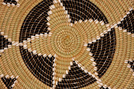Colorful pattern on a hand woven African basket	