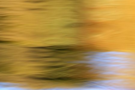 Water background with multi-colored reflections and wave patterns の写真素材