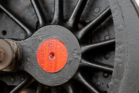 Close-up of a wheel of a vintage steam locomotiveの写真素材