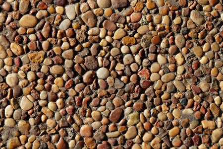 Background of small smooth stone pebbles
