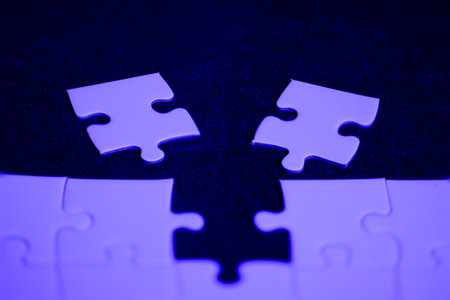 Purple puzzle to choose which piece fits in the holeの写真素材