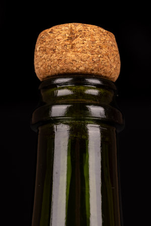Close-up of a champagne cork placed vertically on the right side of a black background. Ideal for celebrating special occasions like New Year's Eve or Christmas.の写真素材
