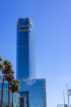 Barcelona, Spain - September 15, 2024: The modern glass facade of Wella Hotel stands out, capturing the essence of Barcelona's architectural eleganceのeditorial素材