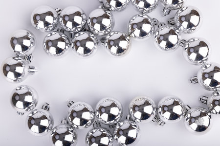 A beautiful display of Christmas ornaments in assorted sizes surrounds the central area, evoking a cheerful holiday atmosphereの写真素材