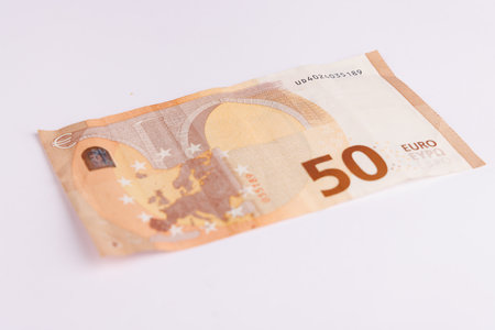 This image features a 50 euro banknote, showing its vibrant colors and intricate designs, perfectly...
