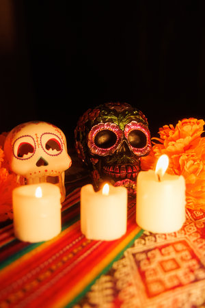 Ancestral homage with vibrant candles, skulls and magnolia flowers arranged on a traditional altar...