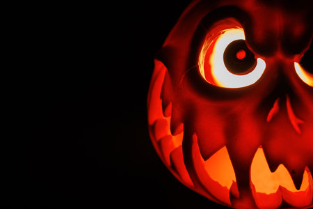 Glowing carved pumpkin symbol of Halloween night and horror.の写真素材