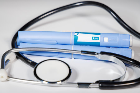 Semaglutide GLP-1 injection pens on white surface for medical background conceptの写真素材