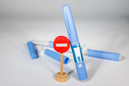 GLP-1 medication shown with healthcare tools to express diabetic treatment and weight management.の写真素材