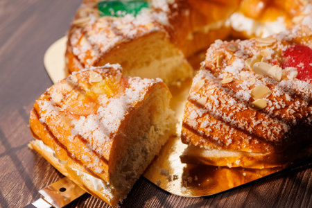 Delicious Epiphany pastry filled with thick whipped cream and topped with fruits on a dark wood background. A staple of January 6th celebrations!!の写真素材