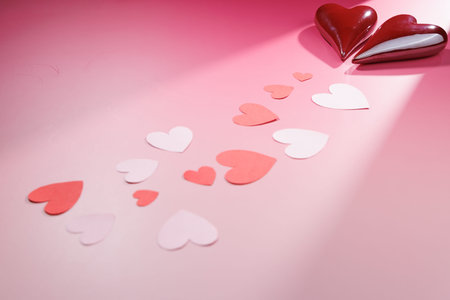 Hearts on pink. Ideal for representing couple love, romantic anniversaries and clean holiday designs for mobile apps or social marketing ads.の写真素材