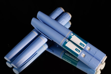 Health pens on a mirror. Ideal for representing pharmaceutical care, weight management programs and...