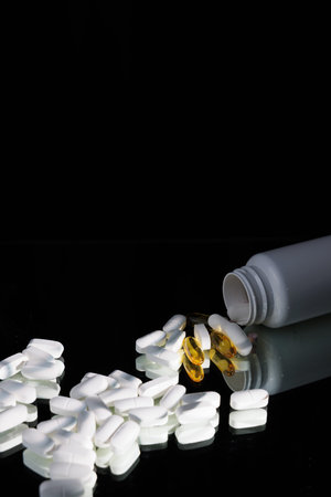 Healthcare tablets on a black mirror. High quality image for metabolic syndrome, chronic disease...