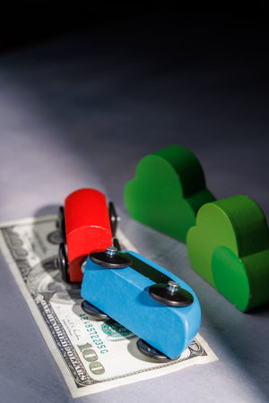 Wooden toy train on money bills. Ideal for representing high risk investments, political changes and the rapid movement of global financial capital.の写真素材