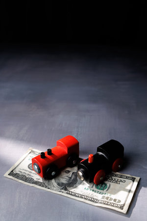 Toy train on money bills. High quality image for representing rising fares, commuting costs and the struggle of accessing transport for the poor.の写真素材
