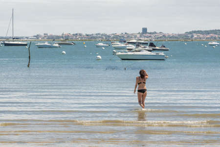 Arcachon Bay (France), young woman having a seaの写真素材