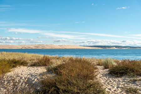 View of the Dune of Pilat, or Pyla, the highest sand dune in Europe, from the Cap Ferret on the other side of Arcachon Bay, Franceの写真素材