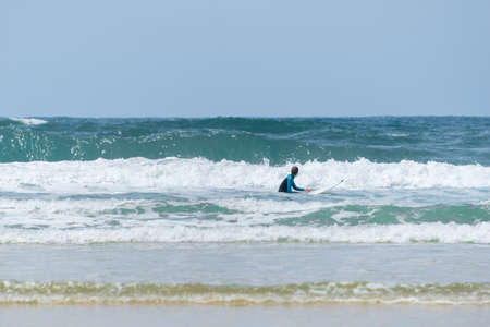 Surfer on the beach of Le Porge on the French Atlantic coastの写真素材
