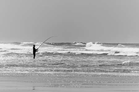 Fisherman on the beach of Le Porge on the French Atlantic coastの写真素材