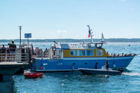 Tourists embark at Cap Ferret to cross the Arcachon Bay to Arcachon or for a cruiseのeditorial素材