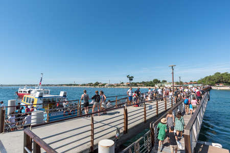 Tourists embark at Cap Ferret to cross the Arcachon Bay to Arcachon or for a cruiseのeditorial素材