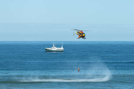 Hourtin, France - 08-07-2020: Civil Security rescuers train in helicopter hoisting on Houtin beach,...