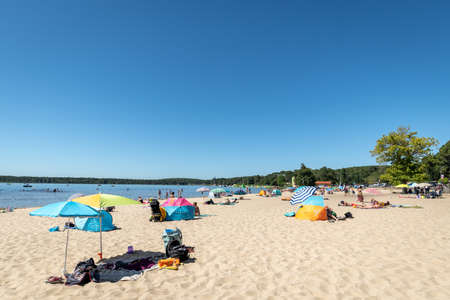 LACANAU, FRANCE - 05-08-2020: well known for its beaches on the ocean, Lacanau also has a large lake whose beaches (here is The Moutchic) and calm waters are popular with families with children.のeditorial素材