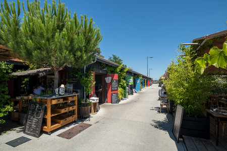 Cap Ferret, France - 07-08-2022: The small oyster district of Claouey, with its oyster huts lined up in front of the tasting terracesのeditorial素材