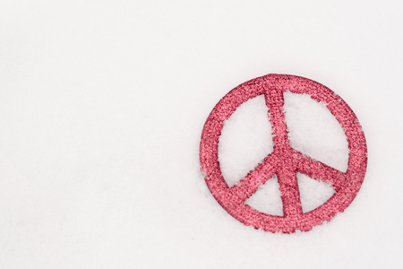 red peace sign isolated in snow2の写真素材