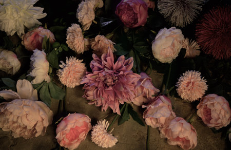 Pink and white peony flowers in a floral decoration, closeup of photo