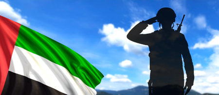Silhouette Of A Solider Saluting on the background of sky and UAE Flag. UAE national holidays, National Day, Commemoration Day - conceptの写真素材
