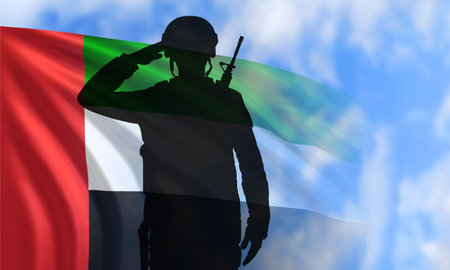 Silhouette Of A Solider Saluting on the background of sky and UAE Flag. UAE national holidays, National Day, Commemoration Day - conceptの写真素材