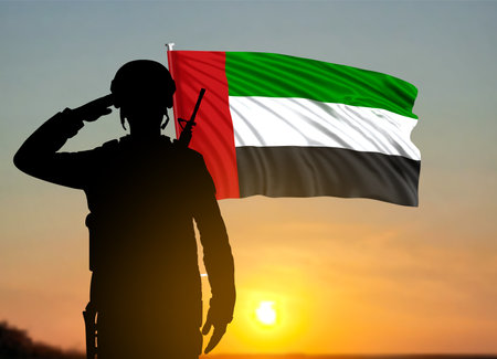 Silhouette of a solider saluting on a background of sunset and UAE flag. UAE national holidays concept. National Day, Commemoration Day. 3d-imageの写真素材