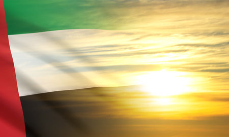 UAE flag on background of cloudy sunset or sunrise. Background for National Day. eps10 vectorのイラスト素材