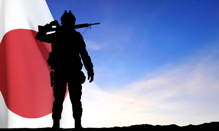 Silhouette of a soldier on background of sunset with Japan flag. Japan Armed Force Concept. eps10 vectorのイラスト素材