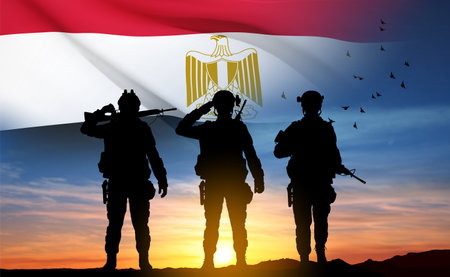 Silhouettes of soldiers against the sunset with Egypt flag. Background for National Holidays. Concept - Armed Forces. eps10 vectorのイラスト素材