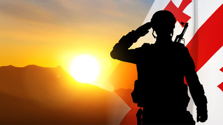 Silhouette of a saluting soldier with Georgia flagのイラスト素材