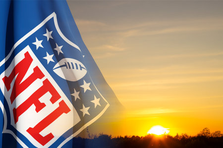 The flag with the NFL logo on background of sky. NFL is a professional American football league. Moscow, Russia - May, 2023のeditorial素材