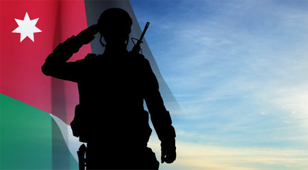Silhouette of a saluting soldier with Jordan flag on background of skyのイラスト素材