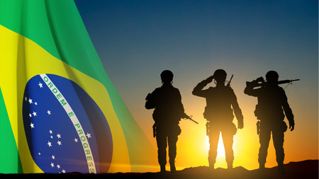 Silhouette of a saluting soldier against the sunset with Brazil flag. Armed Forces of Brazil concept. eps10 vectorのイラスト素材