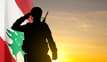 Silhouette of a soldier with Lebanon flag against the sunset.のイラスト素材