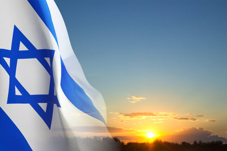 Israel flag against the sunsetの写真素材