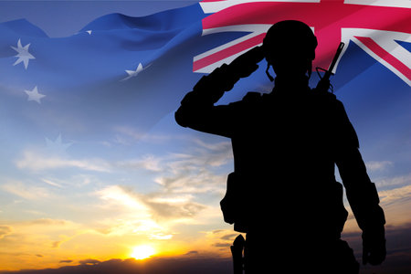Silhouette of Soldier with Australian flag on background of sunset. Concept - Armed Forceの写真素材
