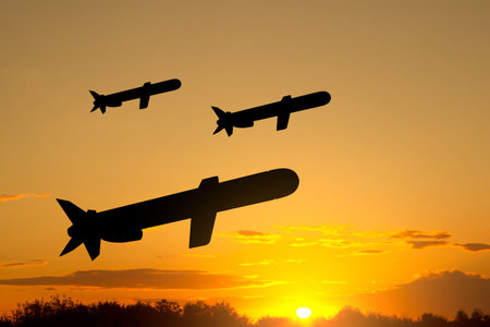 Silhouettes of Tomahawk cruise missiles against the sunsetの写真素材