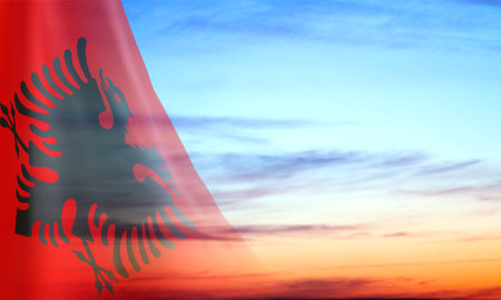 Flag of Albania against the sunset. EPS10 vectorのイラスト素材