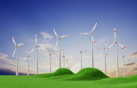 Wind turbines on grass field on background of sky