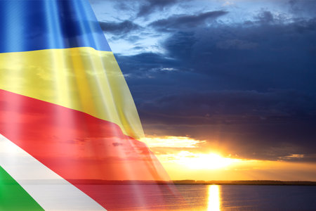 Flag of Seychelles against the sunsetの写真素材