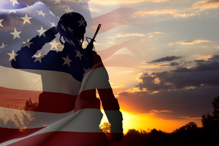 Silhouette of a soldier with USA flag against the sunset. Veterans Day, Memorial Day conceptの写真素材