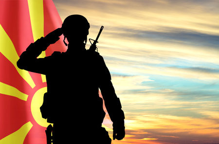 Flag of North Macedonia with soldier silhouette against the sunsetの写真素材