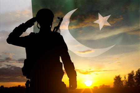 Silhouette of soldier against the sunset with Pakistan flag. National Holidays conceptの写真素材
